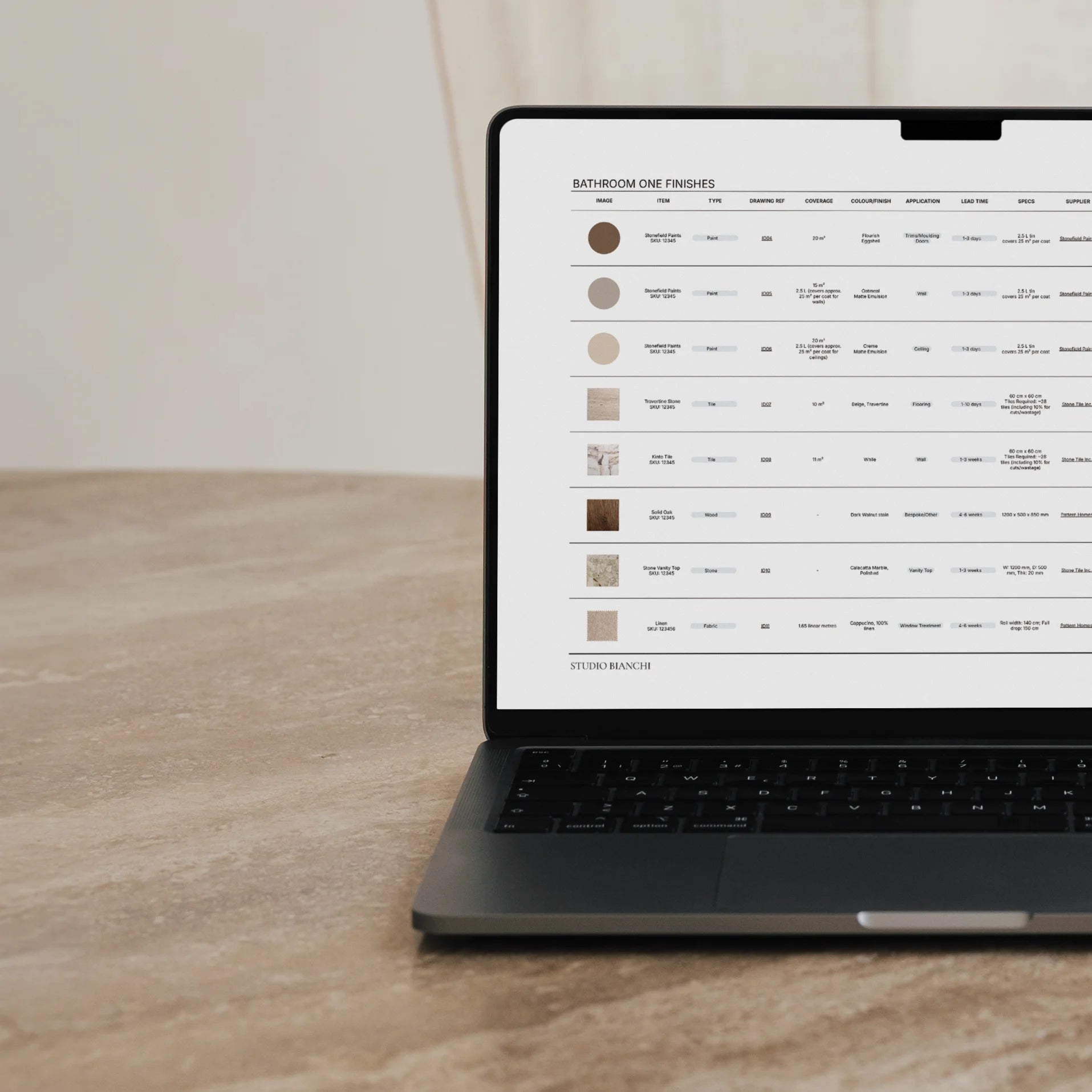 Laptop showing FFE schedule on screen, travertine table