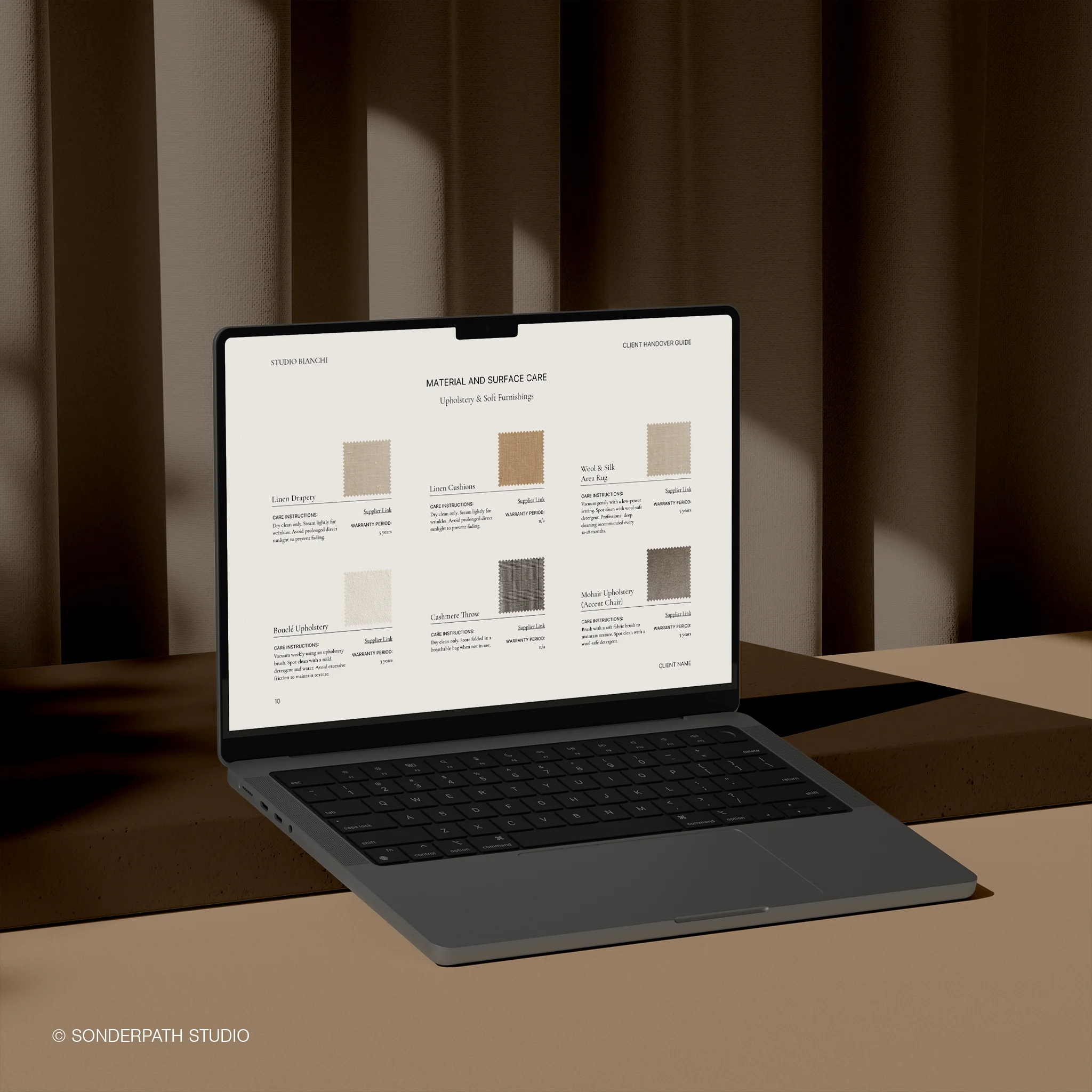 Laptop displaying a material and surface color palette on a brown background