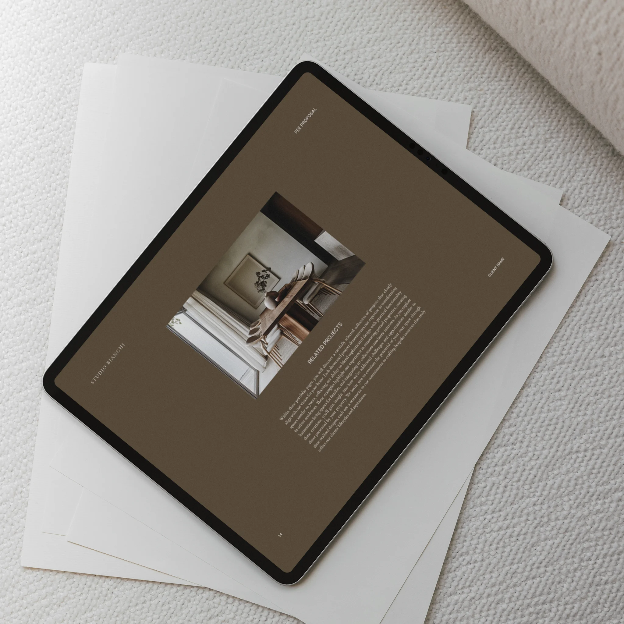 Tablet displaying a projects page of a fee proposal template on a textured surface