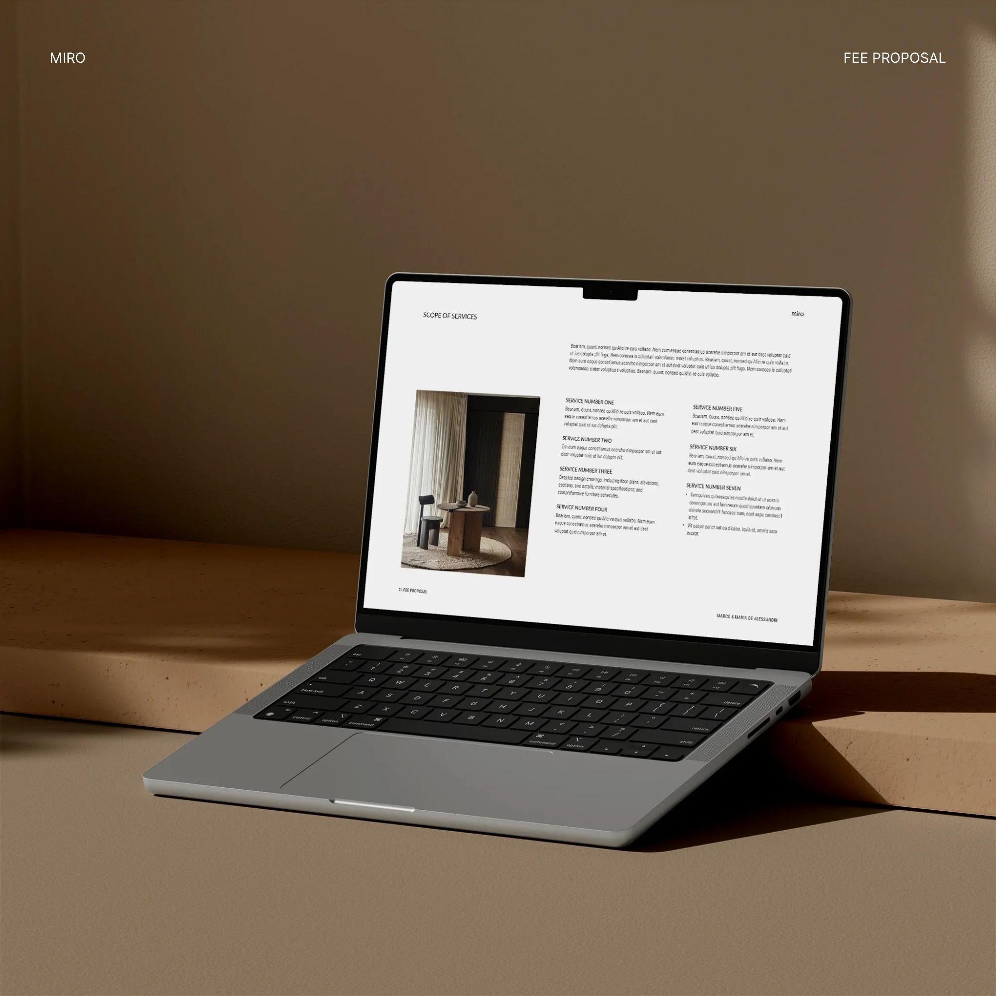 Laptop on a wooden surface with a minimalistic design showing a Scope of Services page of an interior design fee proposal template